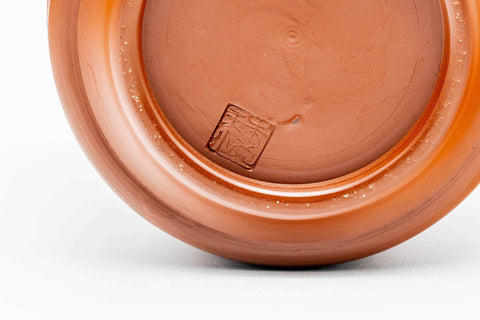 Underside of the teacup, showing the red clay foot.