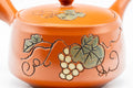 Tezumi — Japanese Kyusu - Grapevine Engraved Tokoname-yaki Obi-ami 360 Mesh Teapot - 370ml — closeup of the base