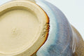 Close-up of the underside and foot of a piece from the set.