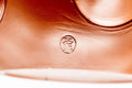 Japanese Kyusu - Smooth Red Shudei Tokoname-yaki Ceramic Teapot - 270ml - closeup of the underside showing the impressed circular maker's stamp