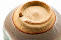Close-up of the unglazed foot with concentric throwing rings.