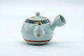 Tezumi — Japanese Tea Set - Villager Decorated Kutani-yaki Kyusu Teapot with 3 Lidded Yunomi Teacups — the teapot side view with the handle