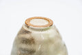 Gohonte Rokurome Mino-yaki yunomi teacup, speckled beige glaze with throwing rings - closeup of the foot ring on the underside