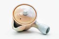 Overhead view of the pink-beige Hagi-yaki kyusu showing the lid knob and spout