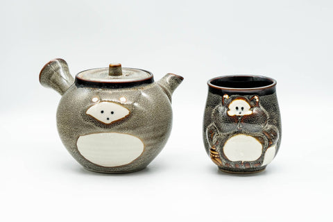 Japanese Tea Set - Tanuki Raccoon Dog Kyusu and Yunomi - front view of the teapot beside the matching teacup