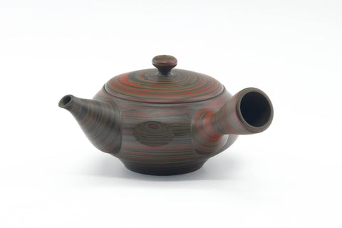 Front view showing the spout and the faceted body of the kyusu.
