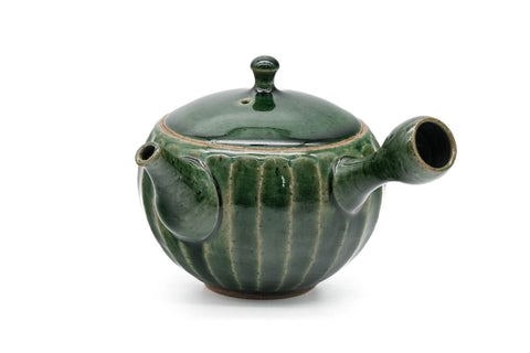 Green faceted Oribe Tokoname teapot, front view of the ribbed green body