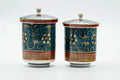 Both lidded teacups from another angle, lids on.