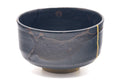 Side view showing the black glaze and the gold kintsugi line.