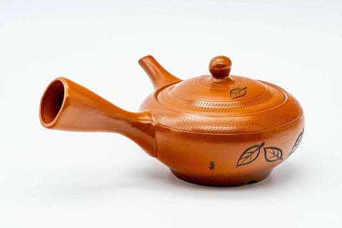 Red shudei Tokoname kyusu, three-quarter view with the spout to the right and handle to the left