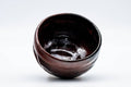 Tezumi — Japanese Matcha Bowl - Black Red Glazed Kuro-Raku Chawan - 300ml — inverted showing the foot ring