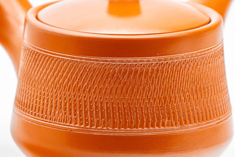 Tezumi — Japanese Kyusu - Red Shudei Tochiri Tokoname-yaki Mesh Teapot - 260ml — closeup of the base