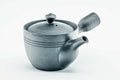 Black kurodei Tokoname-yaki side-handle kyusu with subtle banding, lid on, three-quarter view.