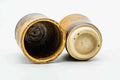 The pair with one cup tipped to show the interior and foot.