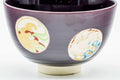 Closeup of the geometric medallions and purple glaze decoration.