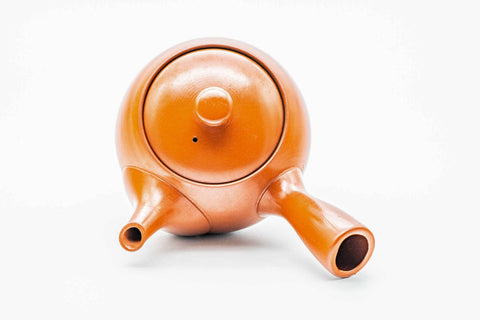 Overhead view of the red shudei Tokoname kyusu showing the lid knob and spout