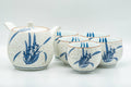 Tezumi — Japanese Tea Set - Blue Floral White Matte Glazed Arita-yaki Debeso Kyusu Teapot and 5 Yunomi Teacups — the full set arranged together