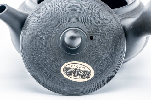 Close-up of the base showing the maker's stamp