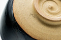 Closeup of the foot and exposed clay base of the chawan with throwing rings