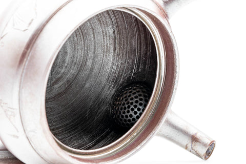 Overhead view into the Banko teapot showing the ceramic debeso strainer and tea-stained interior