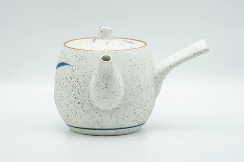 Tezumi — Japanese Tea Set - Blue Floral White Matte Glazed Arita-yaki Debeso Kyusu Teapot and 5 Yunomi Teacups — the teapot side view with the handle