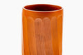 Overhead view into the cup, showing the glazed interior and faceted rim.