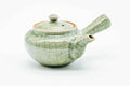 Green celadon Obori Soma kyusu, raised three-quarter view showing the lid knob and handle