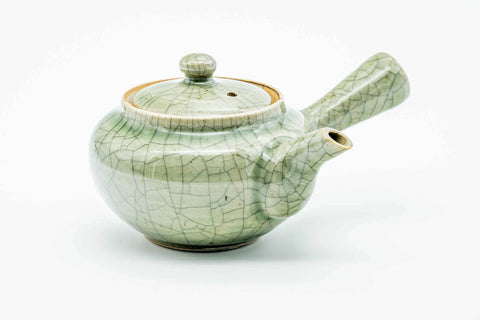 Green celadon Obori Soma kyusu, raised three-quarter view showing the lid knob and handle