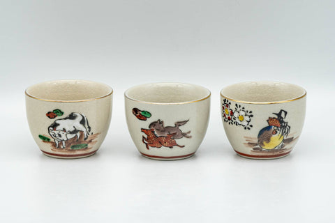 Tezumi — Japanese Teacups - Set of 10 Uniquely Decorated Kutani-yaki Guinomi - 40ml — three-quarter view