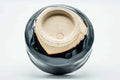 Inverted view of the black chawan showing the carved foot and exposed clay underside
