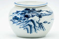 Front view of the bowl highlighting the painted blue landscape decoration.