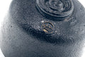 Close-up of the base and foot with the maker's stamp.