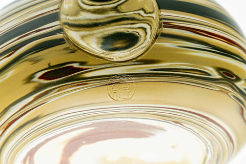 Underside close-up showing the marbled foot and base.