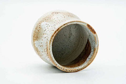 Tilted view showing the glazed interior of the teacup.