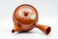 Japanese Kyusu - Yellow Flowers Tokoname-yaki Mesh Teapot - 400ml - top-down view of the lid showing the yellow floral design