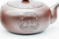Opposite side of the Banko-yaki kyusu showing the engraved floral and rabbit roundel