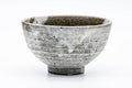 The matcha bowl from another angle, showing the drip glaze.