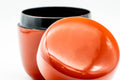 Japanese Natsume - Orange Lacquered Matcha Tea Caddy - 100ml - top-down view with the lid leaning on the body