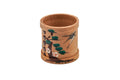 Bentwood cedar magewappa ring painted with a dragonfly and pine, front view.