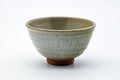 The matcha bowl from another angle, showing the mottled glaze.