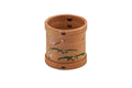 The cedar ring rotated to show the bentwood seam and painted decoration.
