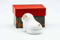Rear three-quarter view of the seated-dog kogo in white glaze.