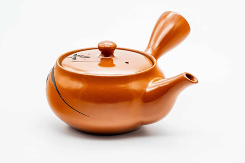 Top view of the engraved red kyusu, lid on.
