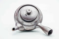 Overhead view of the large kyusu, lid on, showing the collared lid and handle.