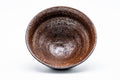Overhead view into the tenmoku bowl, showing the brown glaze pooling at the centre.