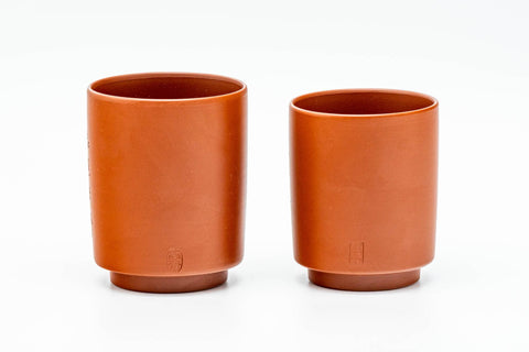 The pair with lids removed, viewed from the plain reverse side.