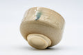 Tezumi — Japanese Matcha Bowl - Tiny Beige Green Hare's Fur Glazed Kiyomizu-yaki Chawan - 100ml — tipped to show the interior