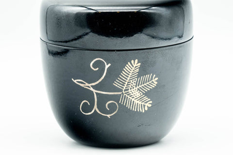 Japanese Natsume - Gold Floral Black Lacquer Matcha Tea Caddy - 80ml - closed caddy, front view of the gold floral motif on black lacquer