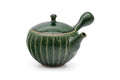 Green faceted Oribe Tokoname teapot, side view showing the handle