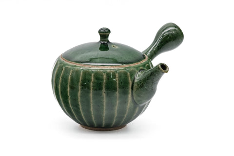 Green faceted Oribe Tokoname teapot, side view showing the handle